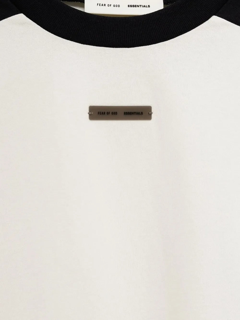 Close up of the white t-shirt, showing texture of the cotton fabric