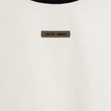 Close up of the white t-shirt, showing texture of the cotton fabric