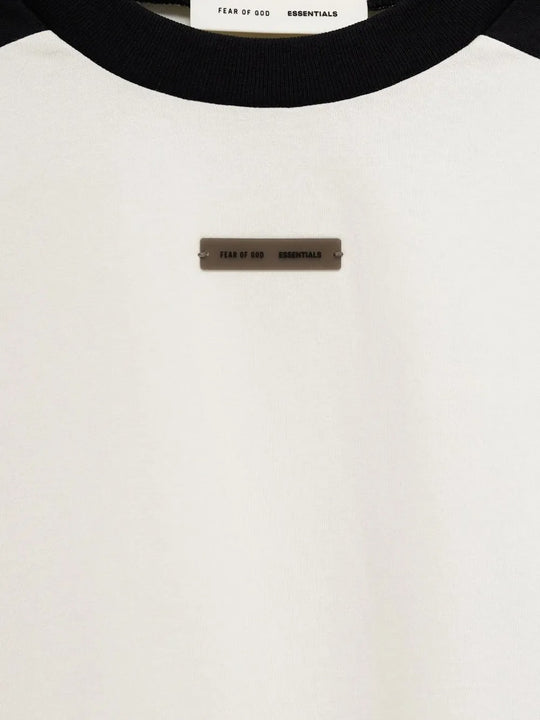 Close up of the white t-shirt, showing texture of the cotton fabric