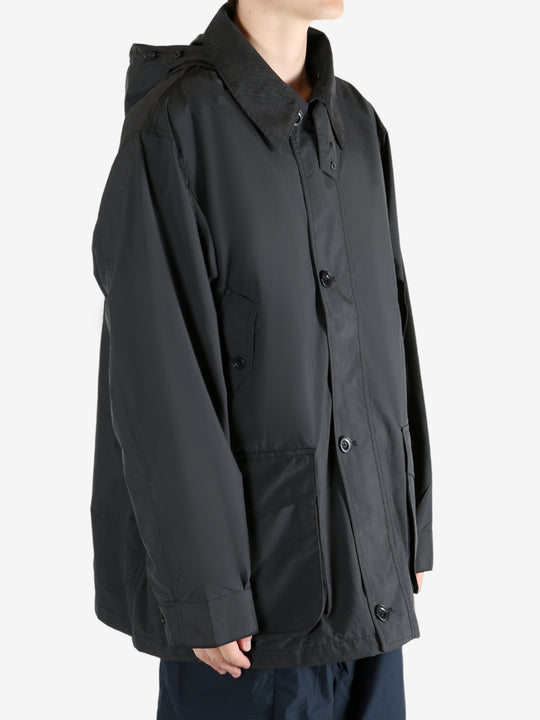 Black jacket worn by a person, showing the jacket's fit