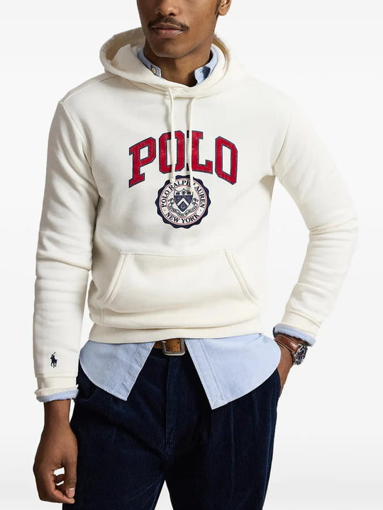 Tan hoodie worn by a person, showing the hoodie fit