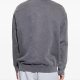 Grey knitwear worn by a person, showing the knitwear fit