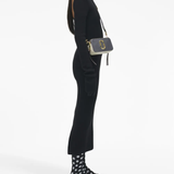 Grey bags worn by a person, showing the bags fit