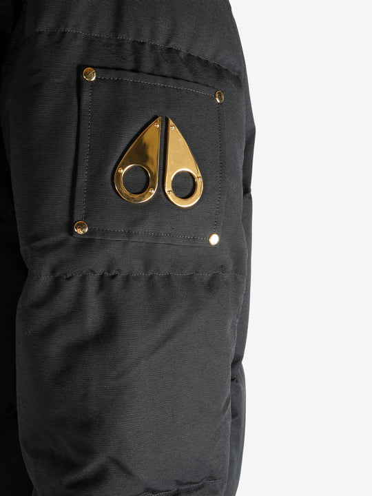 Close up of black jacket, showing texture of the cotton fabric