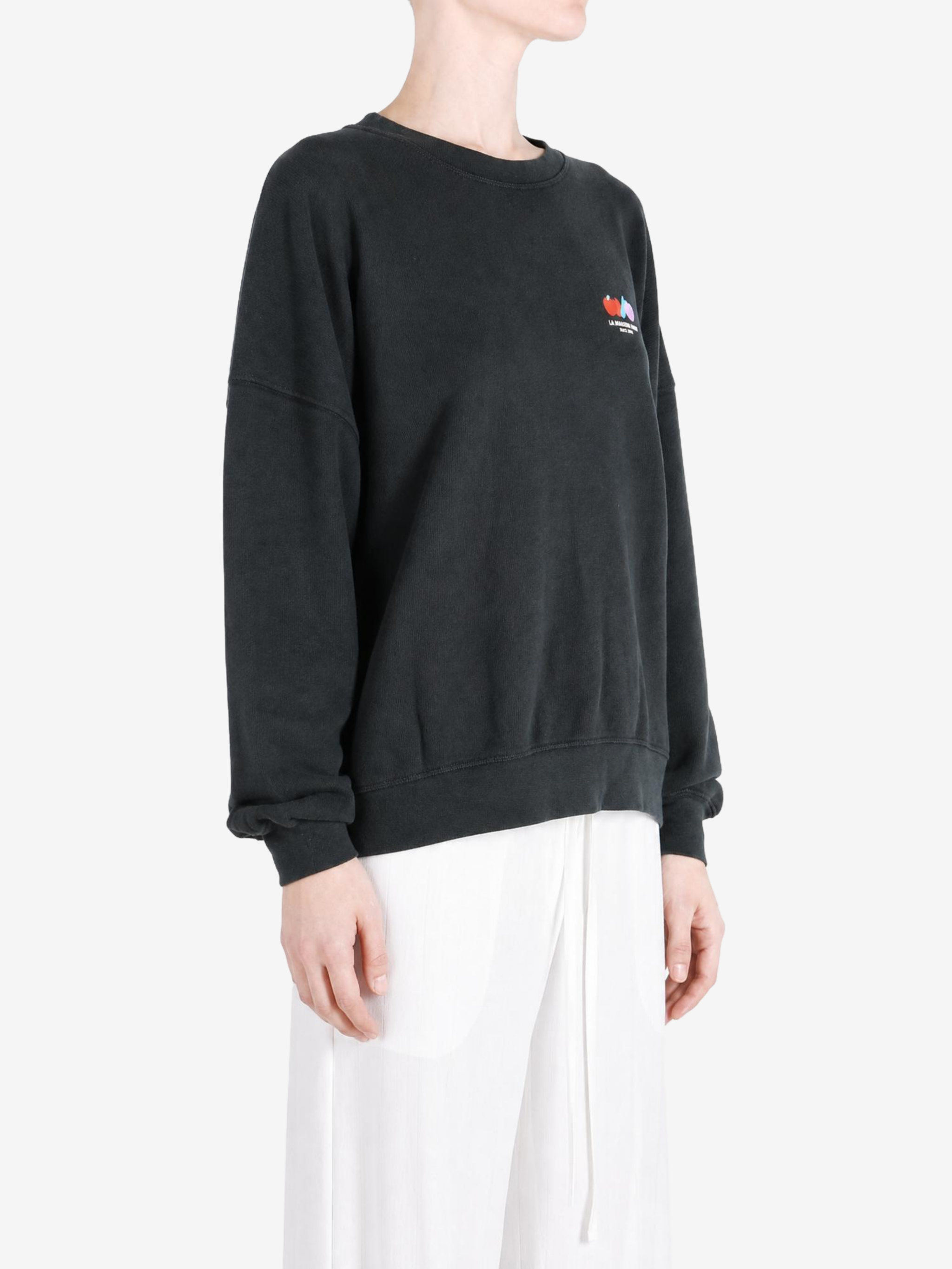 Black hoodie worn by a person, showing the hoodie fit