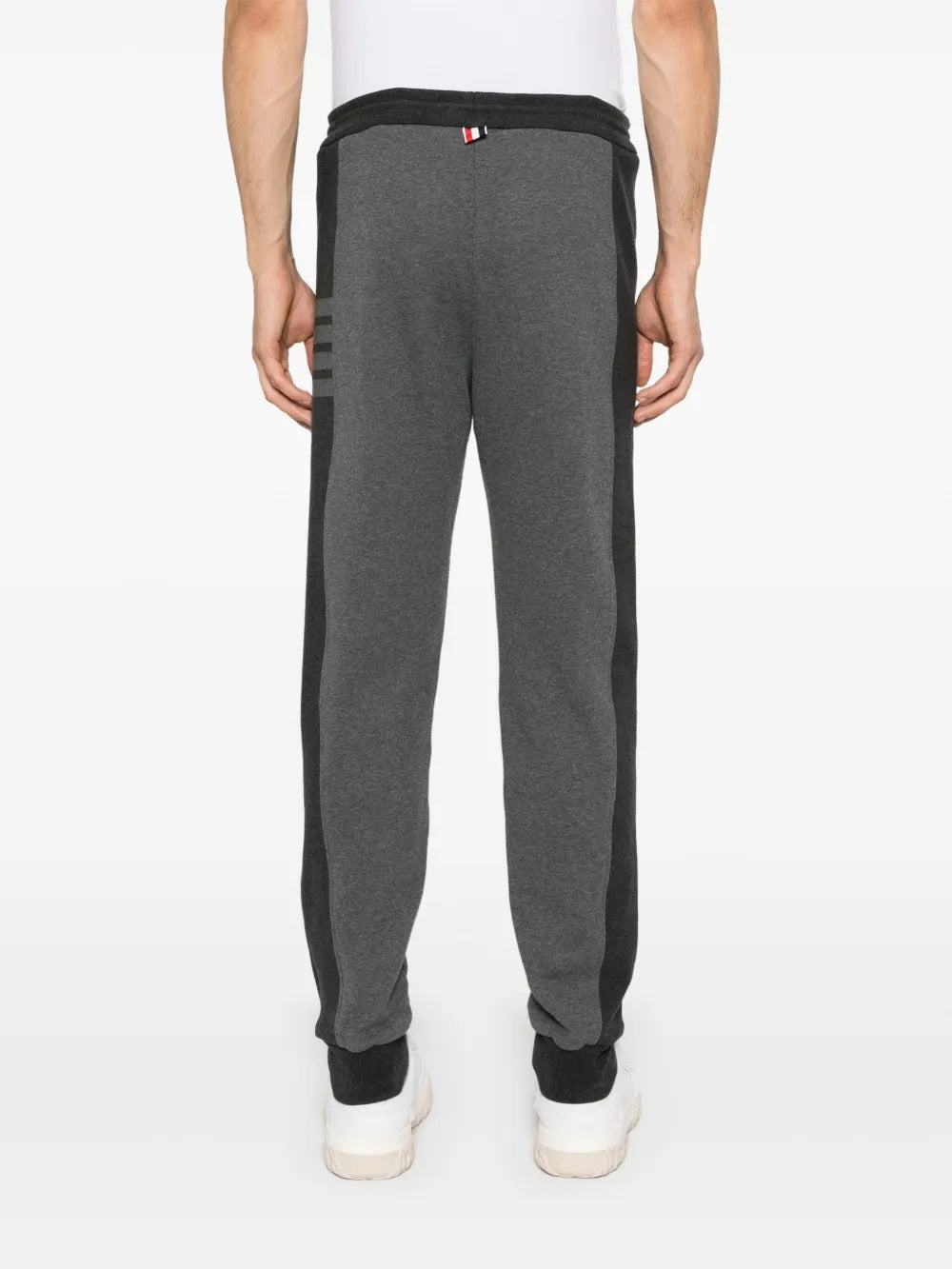 Grey pants worn by a person, showing the pants's fit