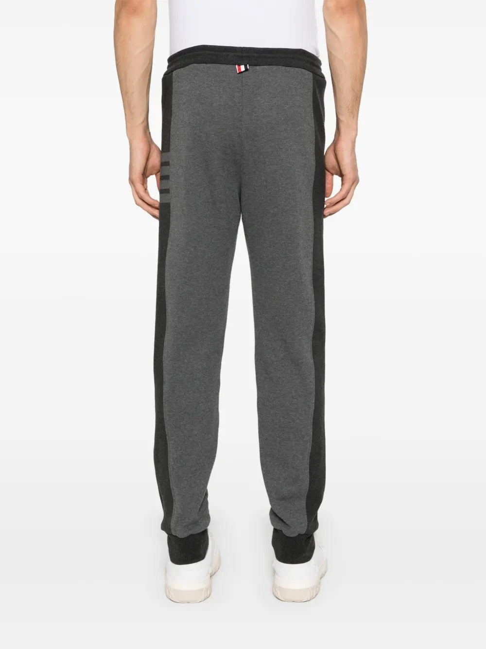 Grey pants worn by a person, showing the pants's fit