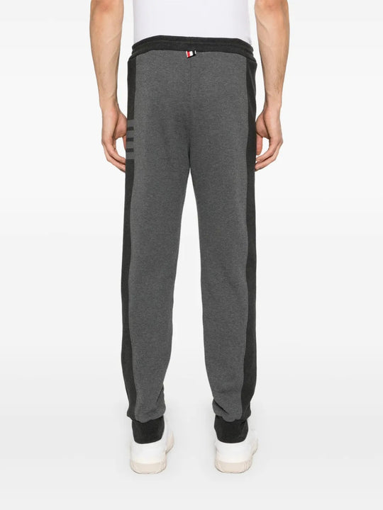 Grey pants worn by a person, showing the pants's fit