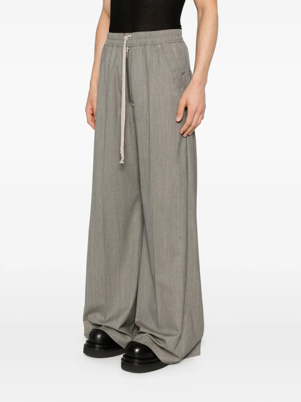 Grey pant worn by a person, showing the pant's fit