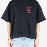 Black crew sweats,worn by a person showing the sweats fit