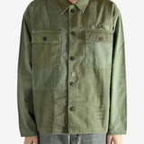 Green shirt worn by a person, showing the shirt's fit