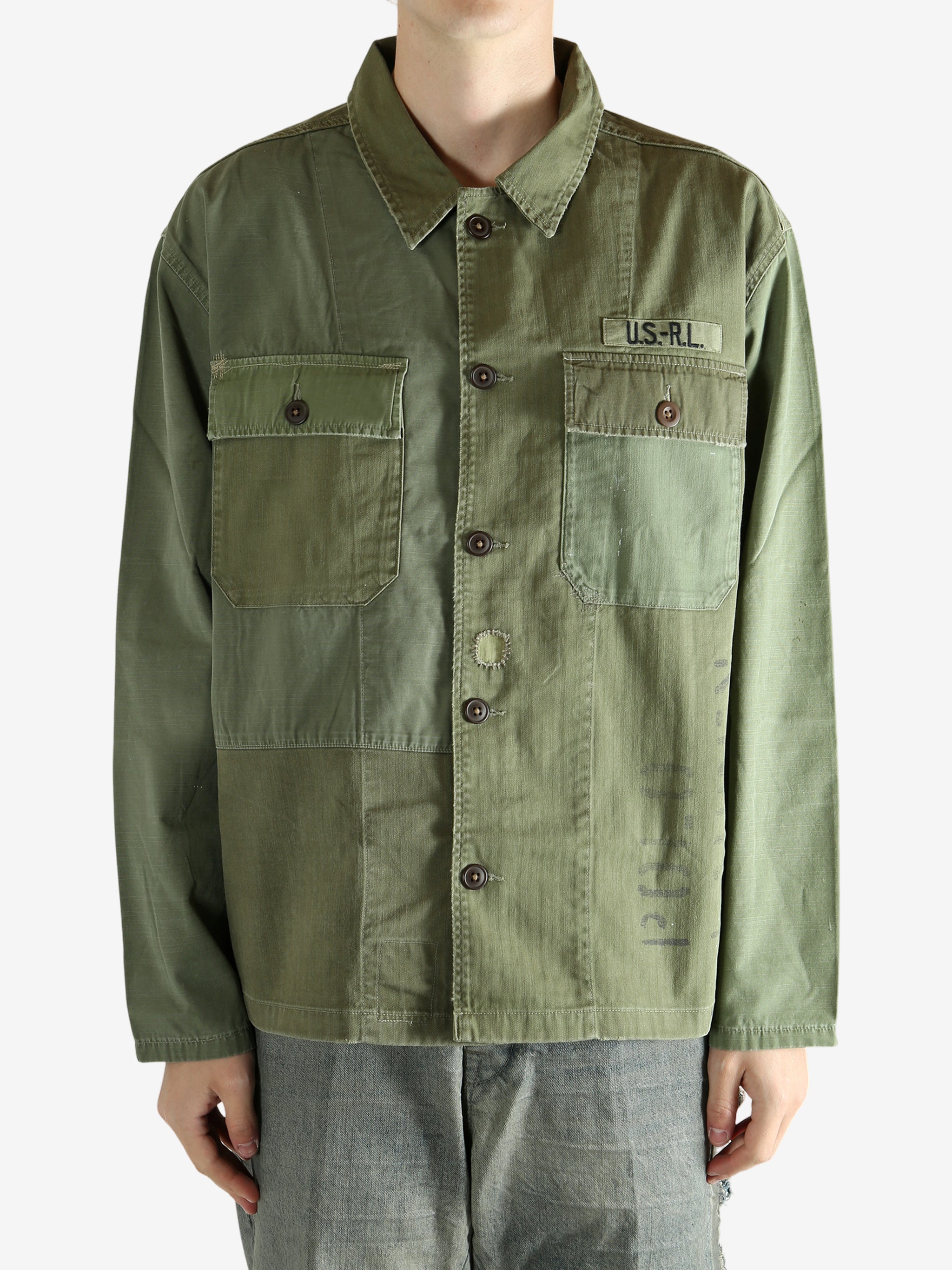 Green shirt worn by a person, showing the shirt's fit