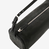 Close up of the black bag, showing texture of the leather fabric