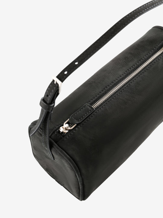 Close up of the black bag, showing texture of the leather fabric