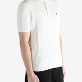 White shirt worn by a person, showing the shirt's fit