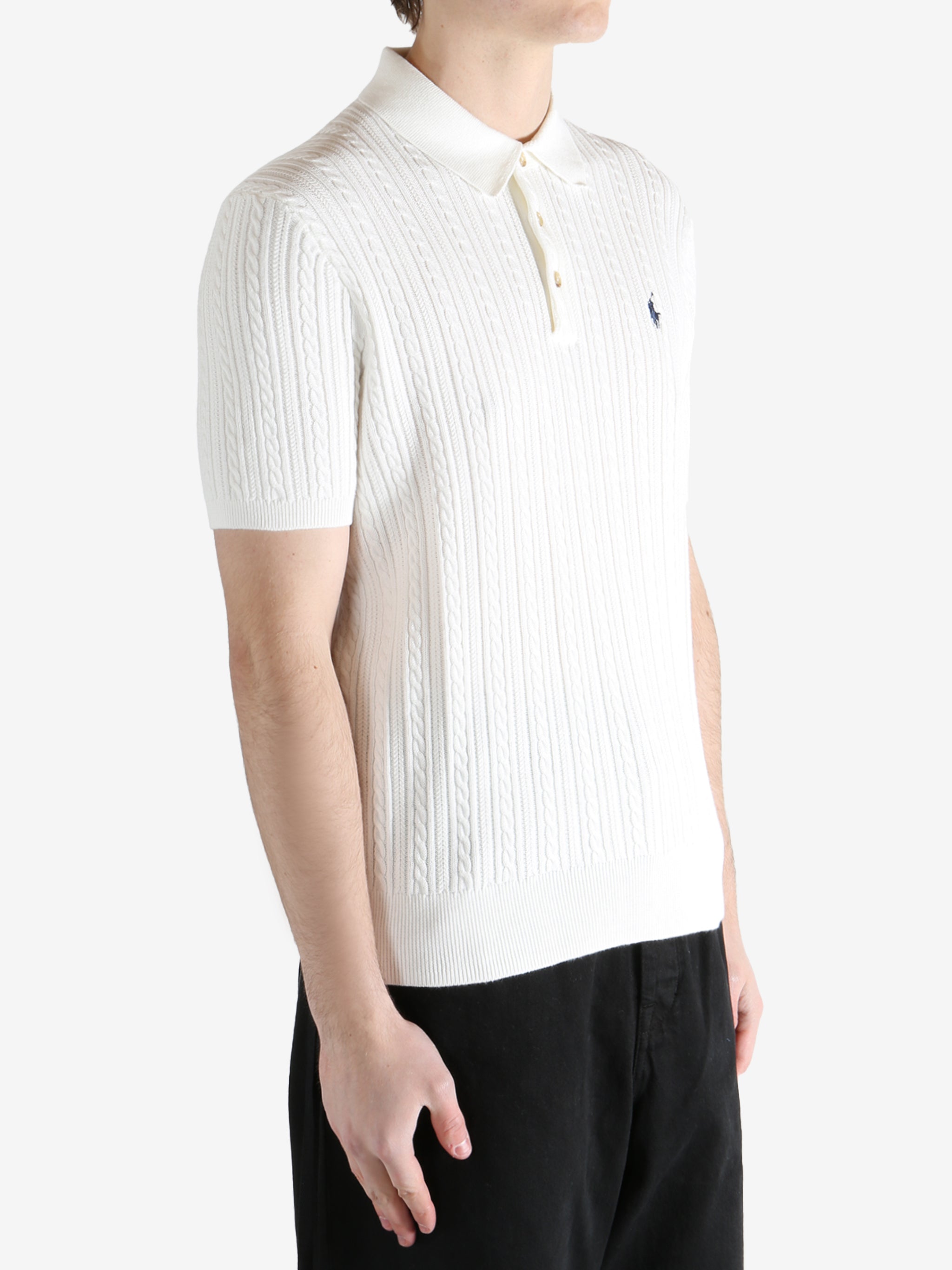 White shirt worn by a person, showing the shirt's fit