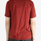 Red t-shirt worn by a person, showing the shirt's fit