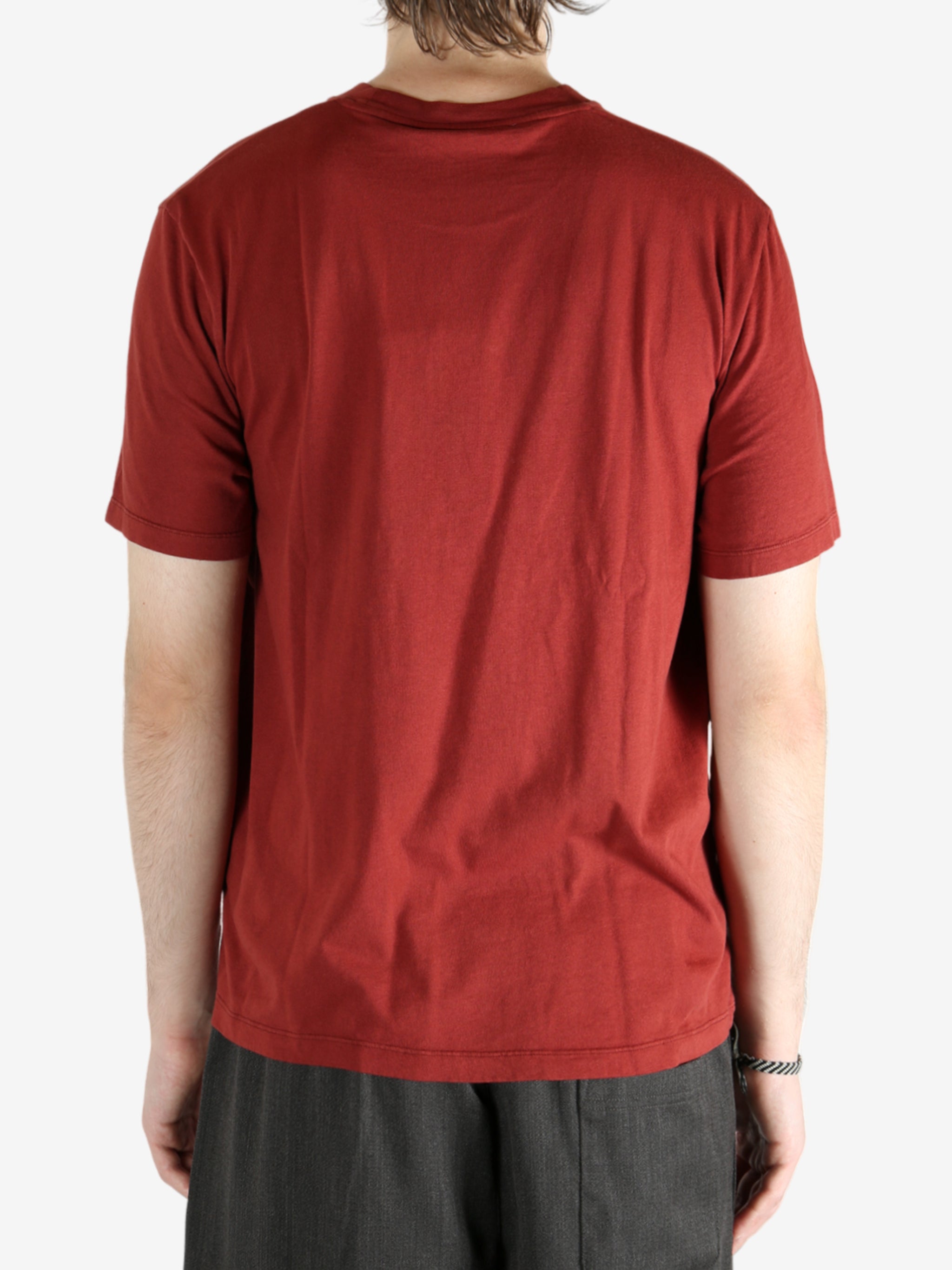 Red t-shirt worn by a person, showing the shirt's fit