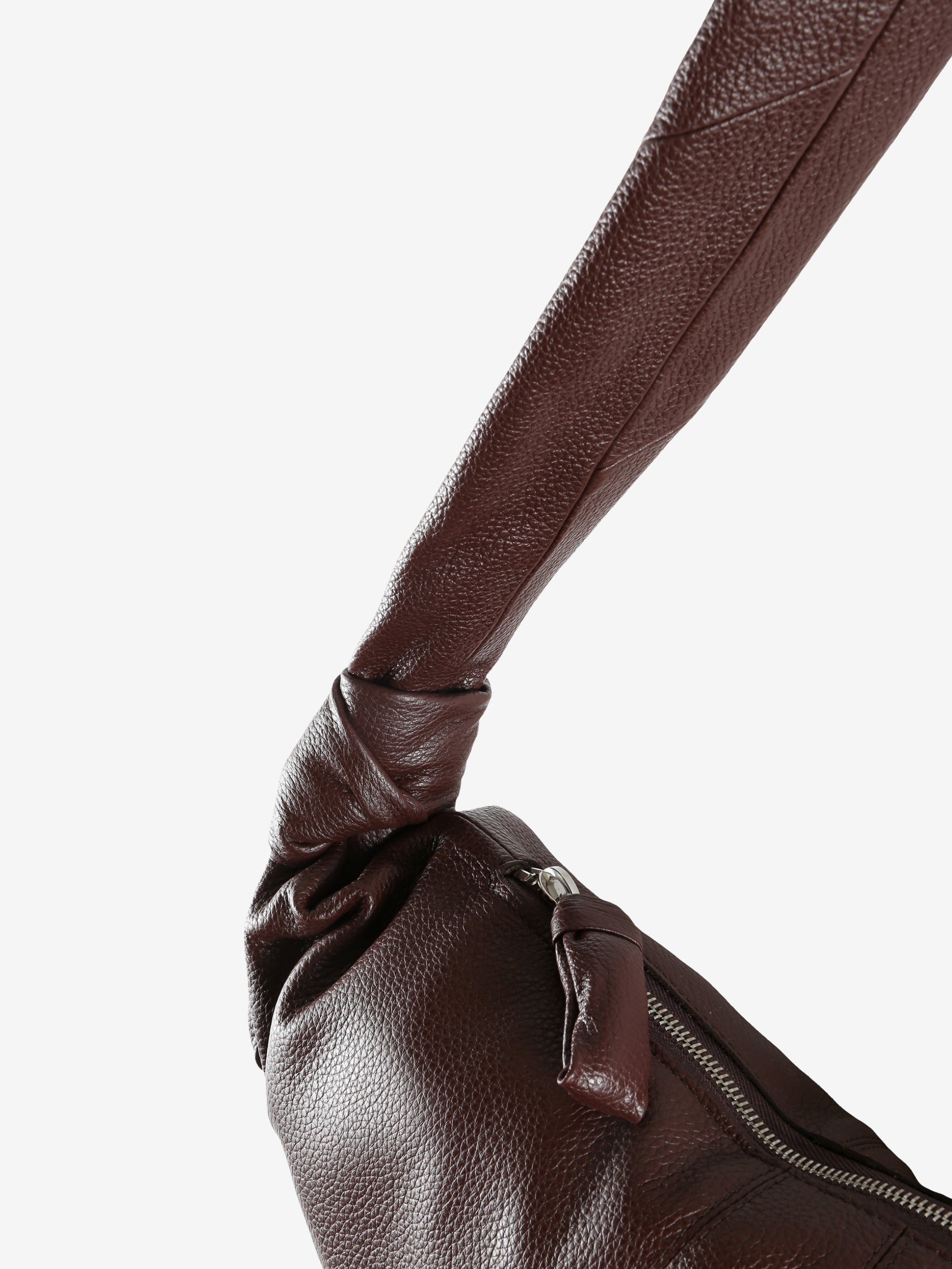 Close up of brown bag, showing texture of the leather fabric