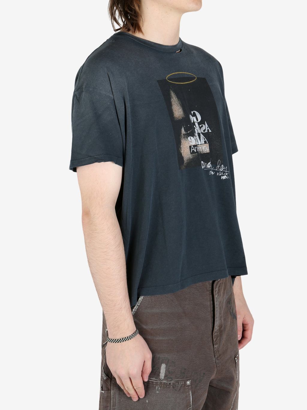Black shirts worn by a person, showing the shirt's fit