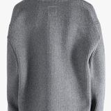 Grey sweater worn by a person, showing the sweater fit
