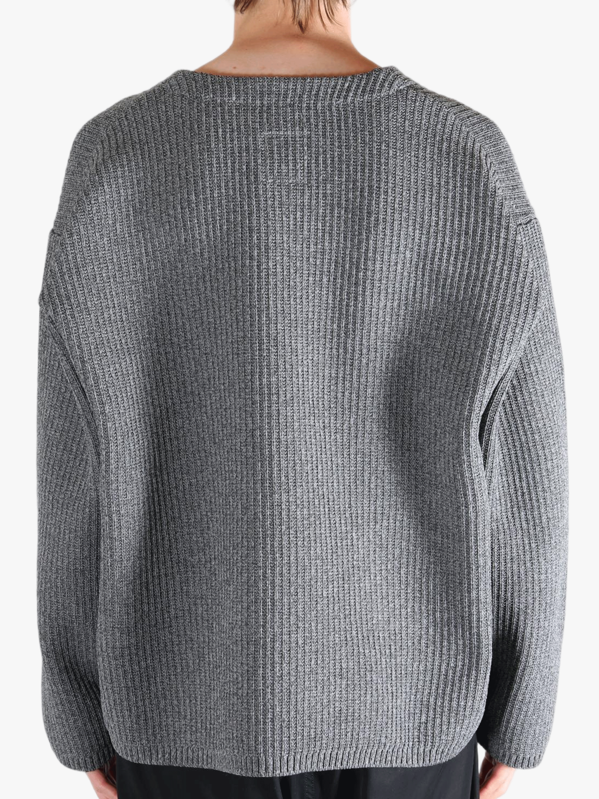 Grey sweater worn by a person, showing the sweater fit