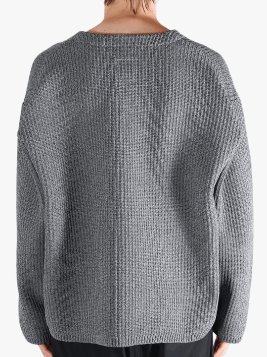 Grey sweater worn by a person, showing the sweater fit