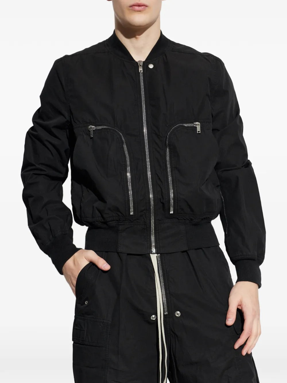 Black jacket worn by a person, showing the jacket's fit