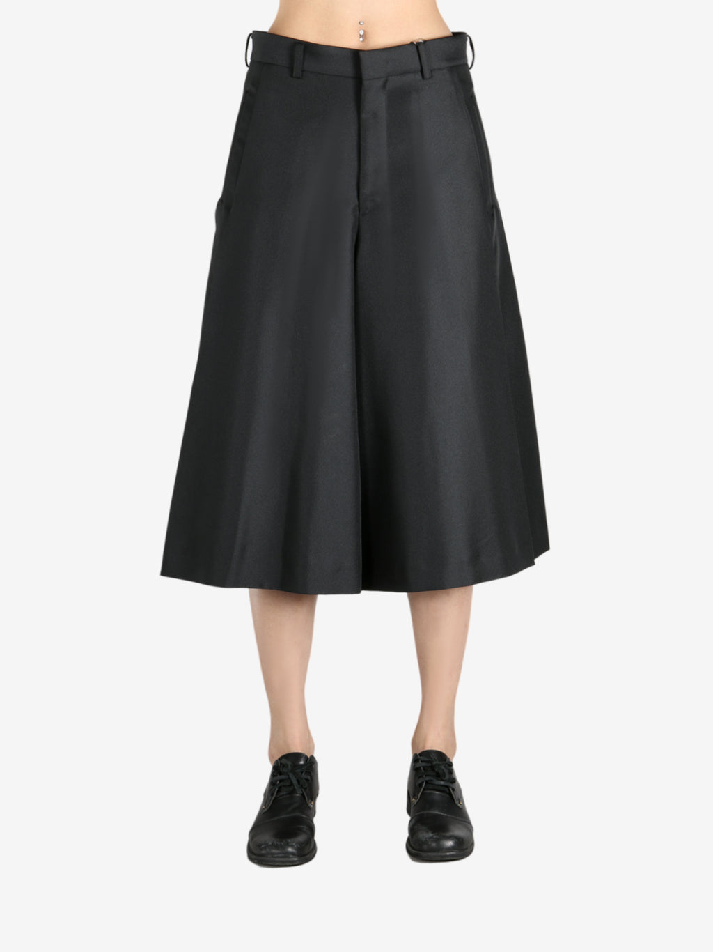 Black pants worn by a person, showing the pants fit