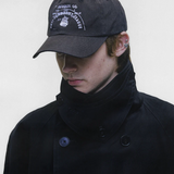 Black hat worn by a person, showing the hat fit