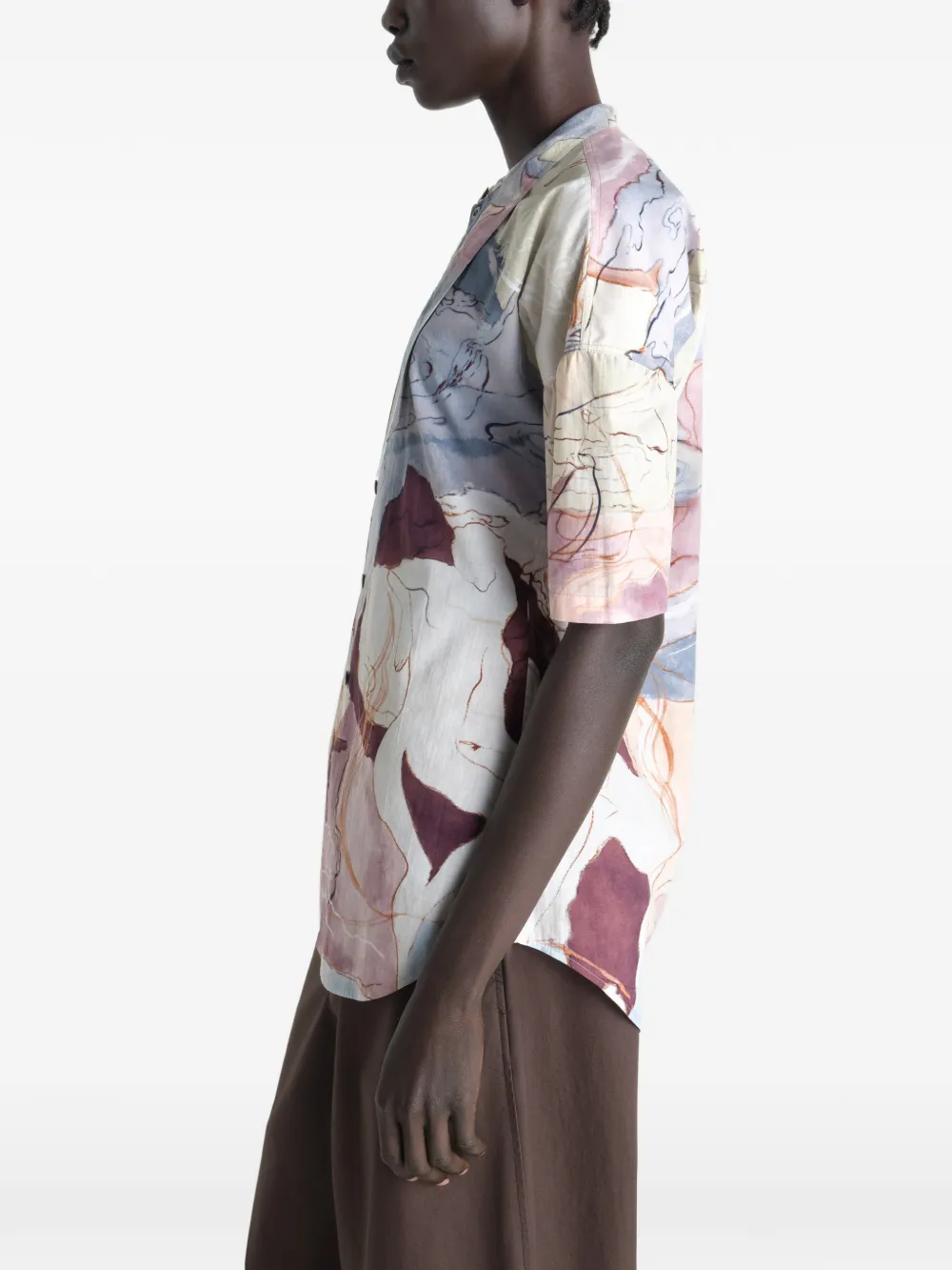 Tan shirt worn by a person, showing the shirt  fit