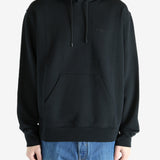 Black hoodie worn by a person, showing the hoodie's fit