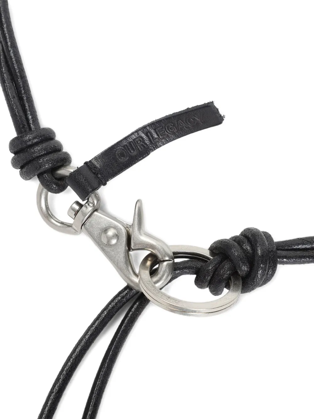 close up of black small-accessories, showing texture of the  leather fabric