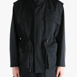 Black jacket worn by a person, showing the jacket fit