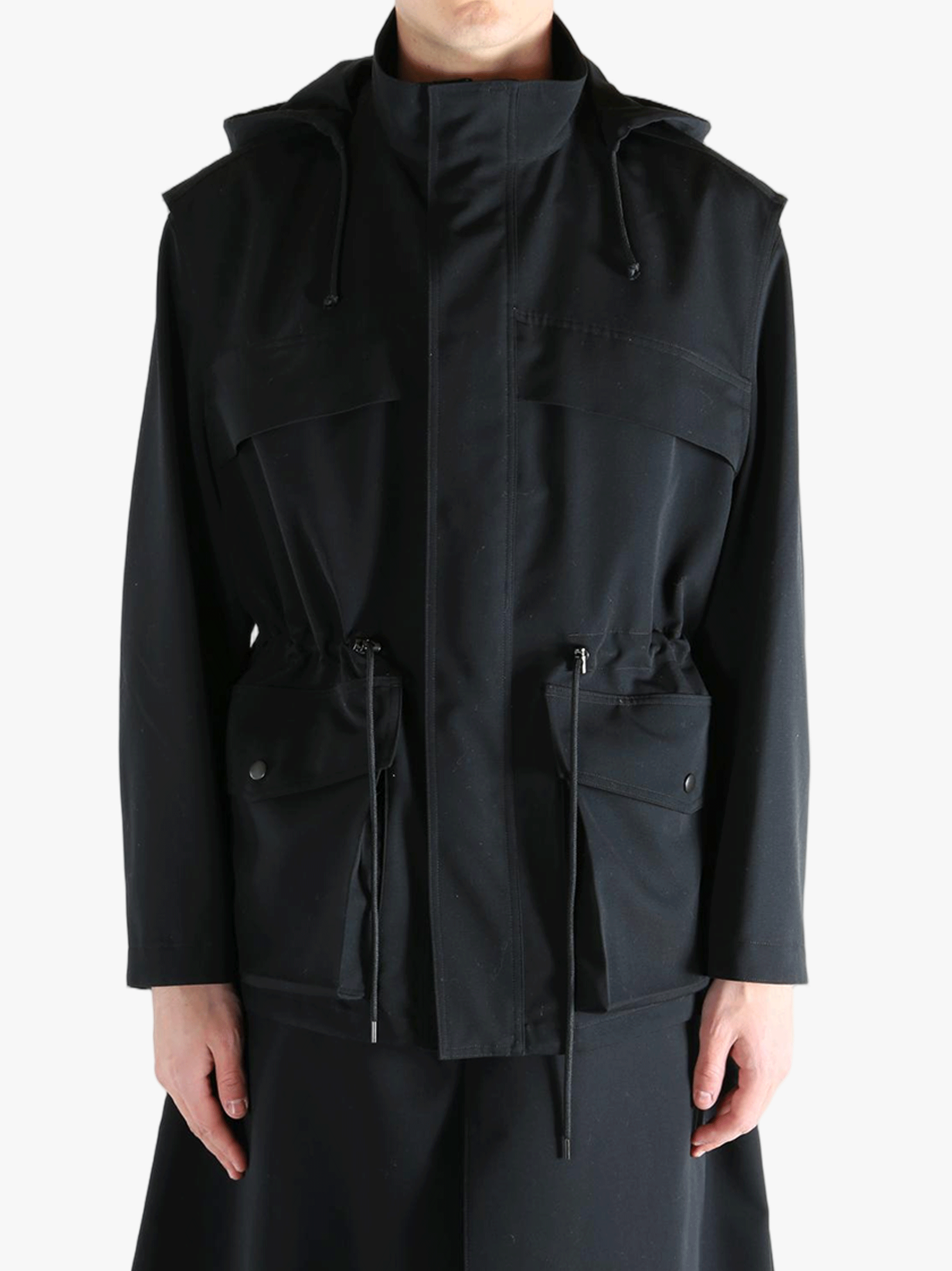 Black jacket worn by a person, showing the jacket fit