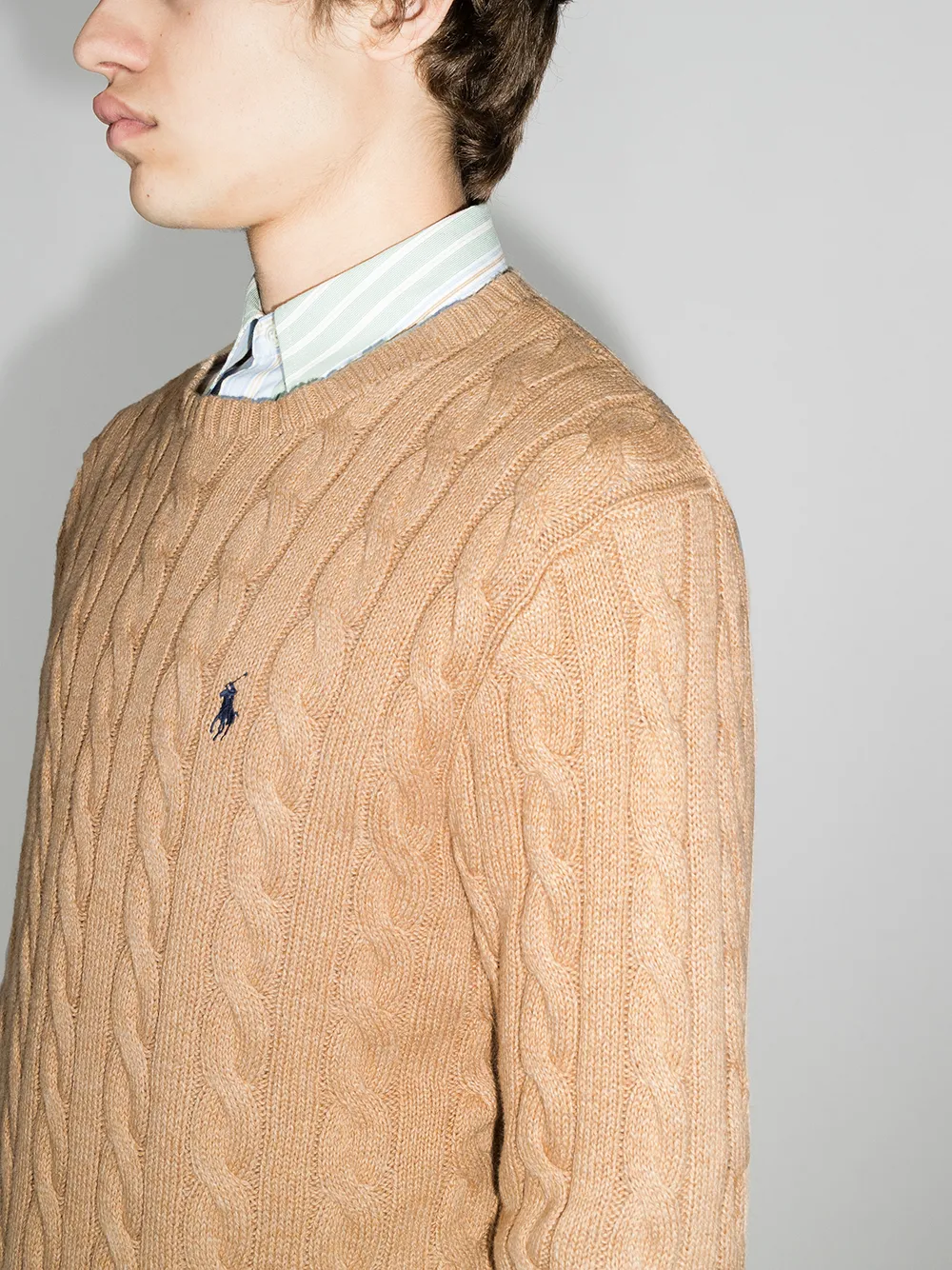 Close up of orange sweater, showing texture of the cotton fabric
