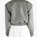 Grey jacket worn by a person, showing the jacket fit