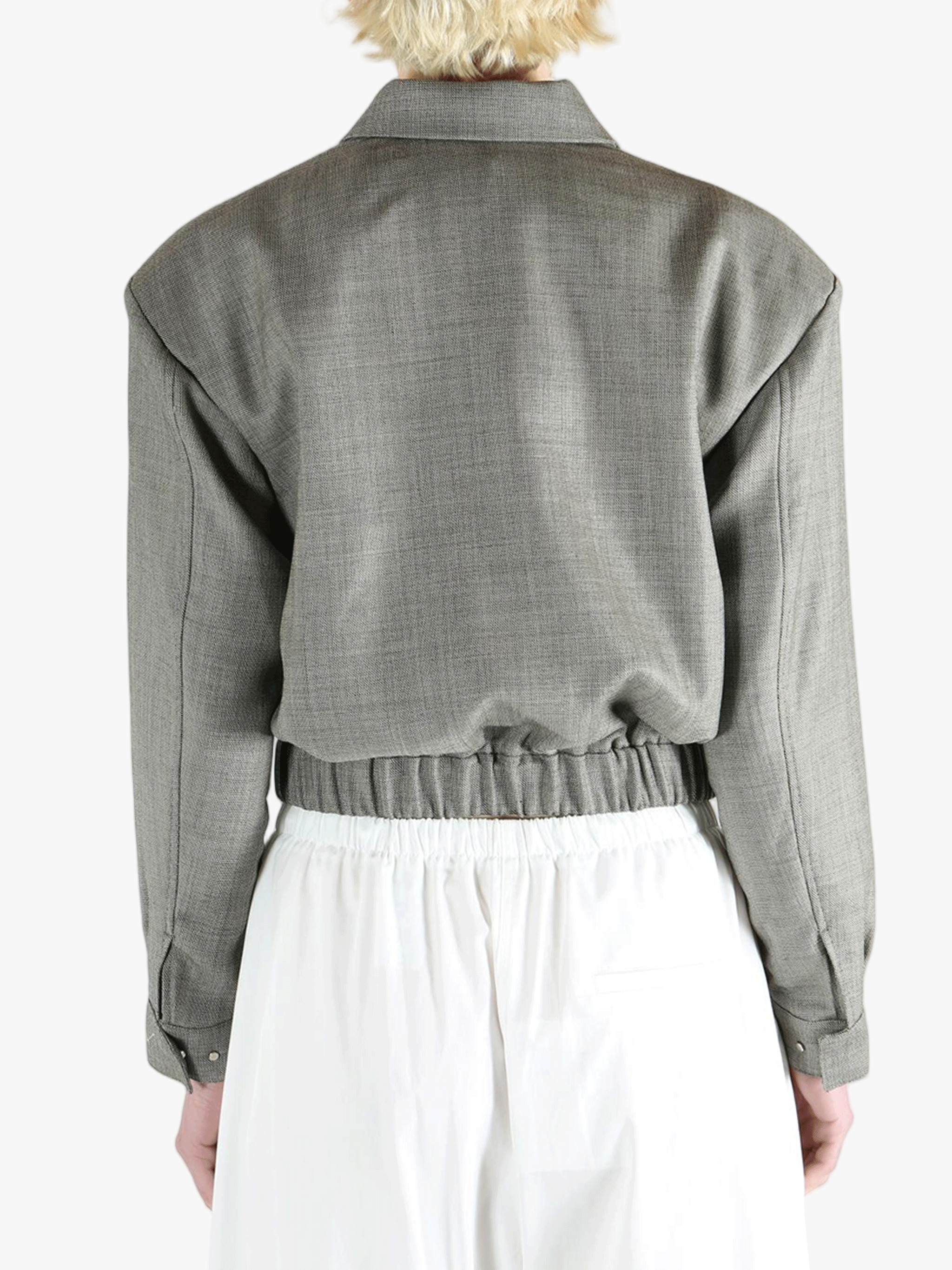 Grey jacket worn by a person, showing the jacket fit