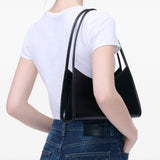 Black bag worn by a person, showing the bag's fit