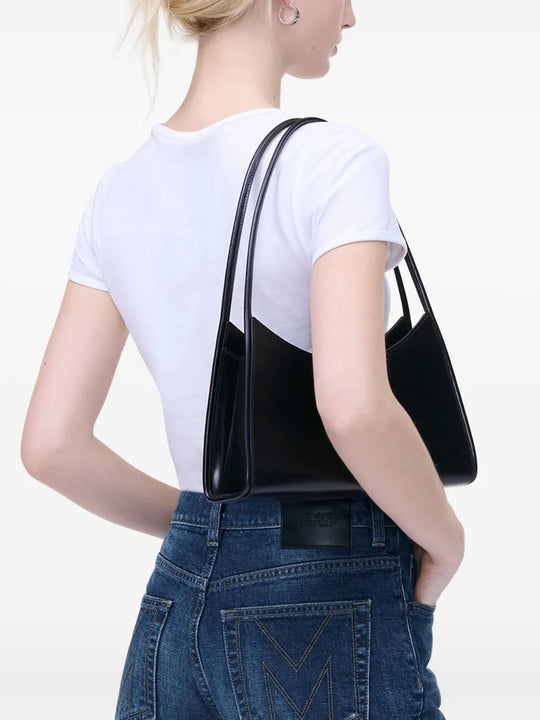 Black bag worn by a person, showing the bag's fit