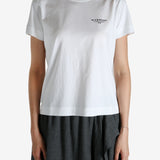 White t-shirt worn by a person, showing the shirt's fit