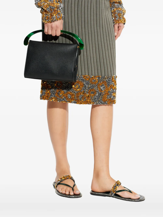 green sandals worn by a person, showing the sandals fit