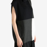 Black top worn by a person, showing the top fit