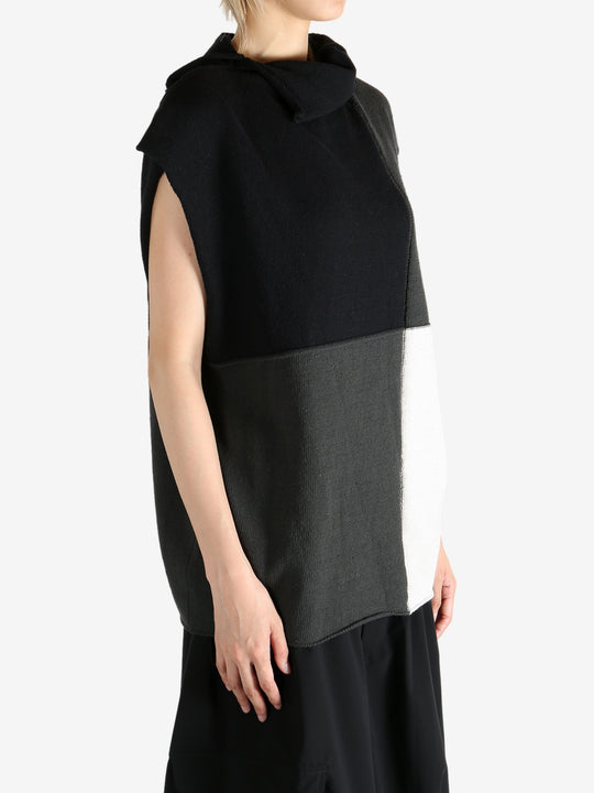 Black top worn by a person, showing the top fit