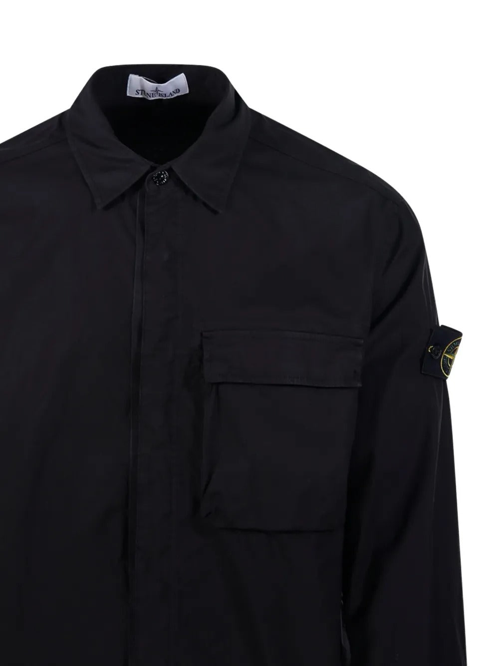 Close up of black shirts, showing texture of the cotton fabric