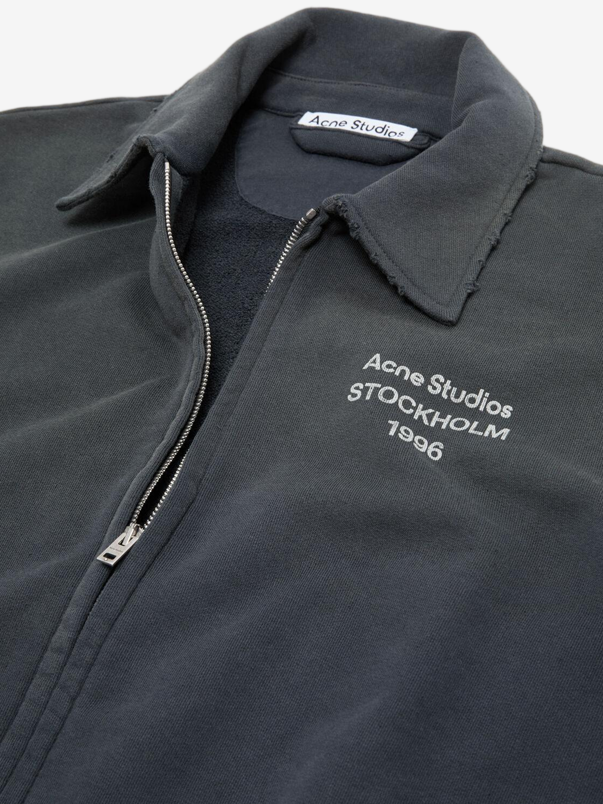 Close up of Black hoodie, showing texture of the 100% cotton fabric