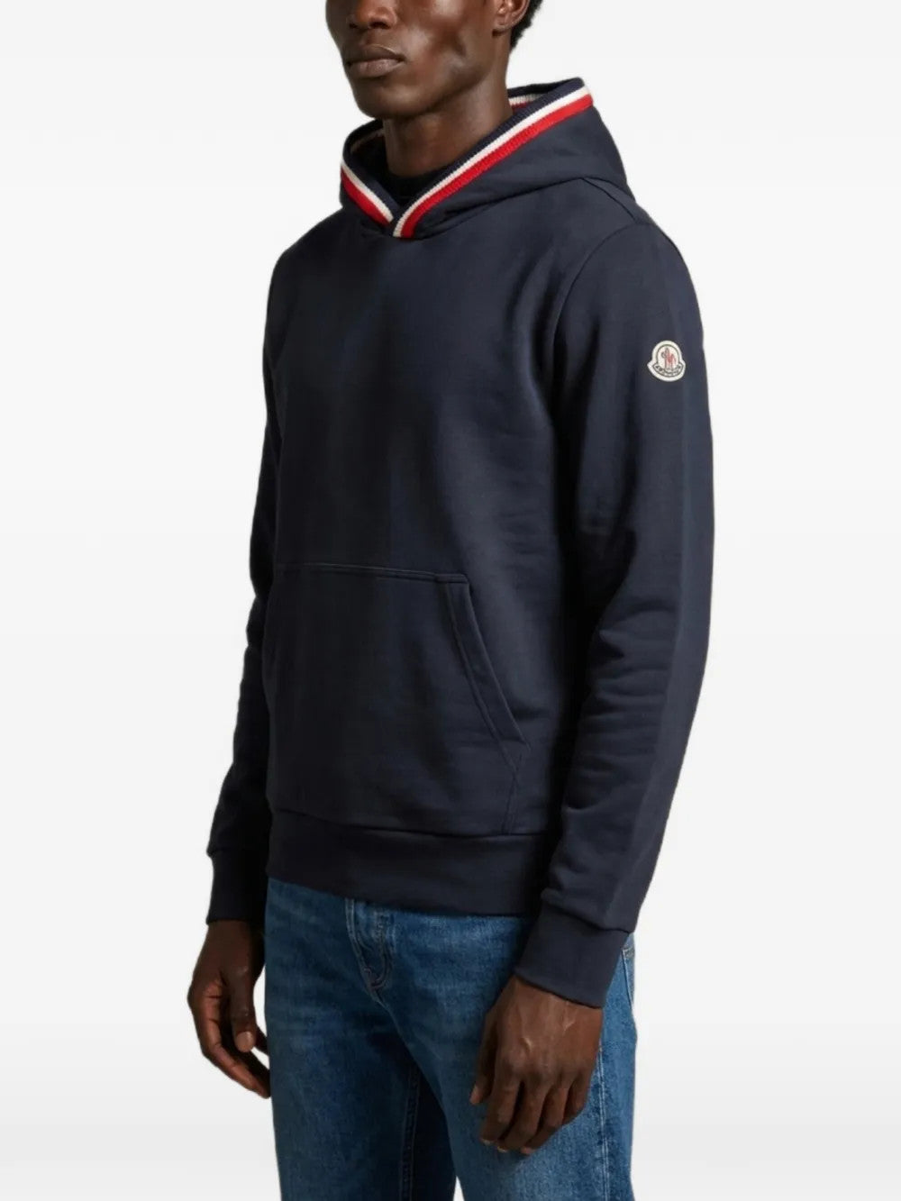 Navy hoodie worn by a person, showing the hoodie fit