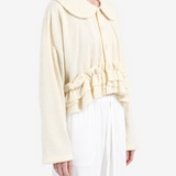 Tan knitwear, front view