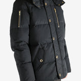 Black jacket worn by a person, showing the jacket's fit