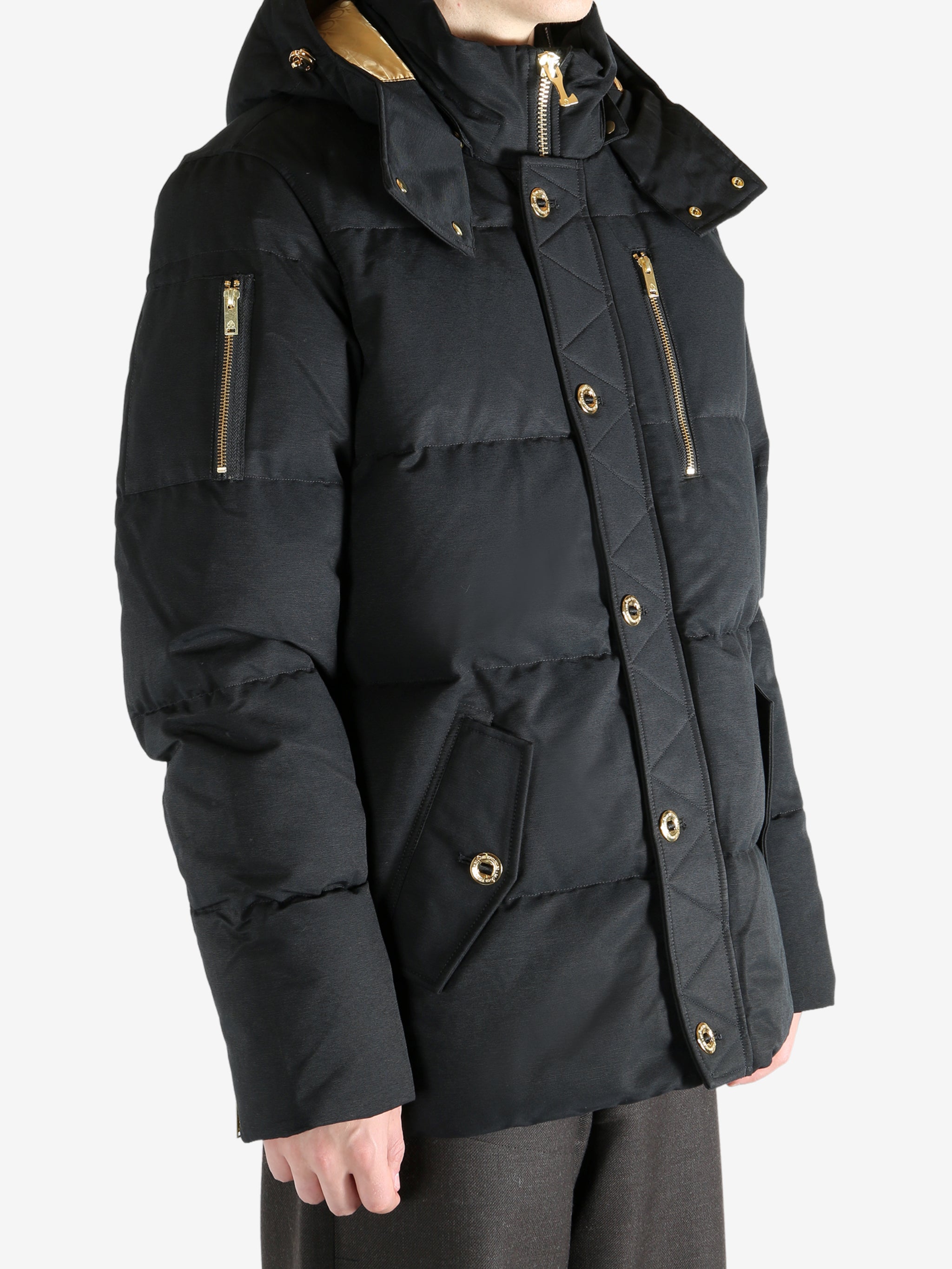 Black jacket worn by a person, showing the jacket's fit